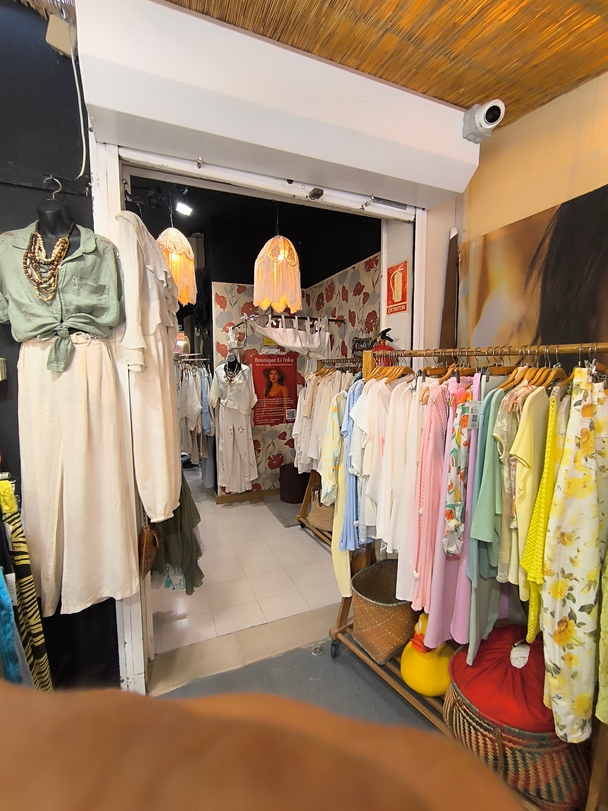 Colorful clothing rack near the side entrance