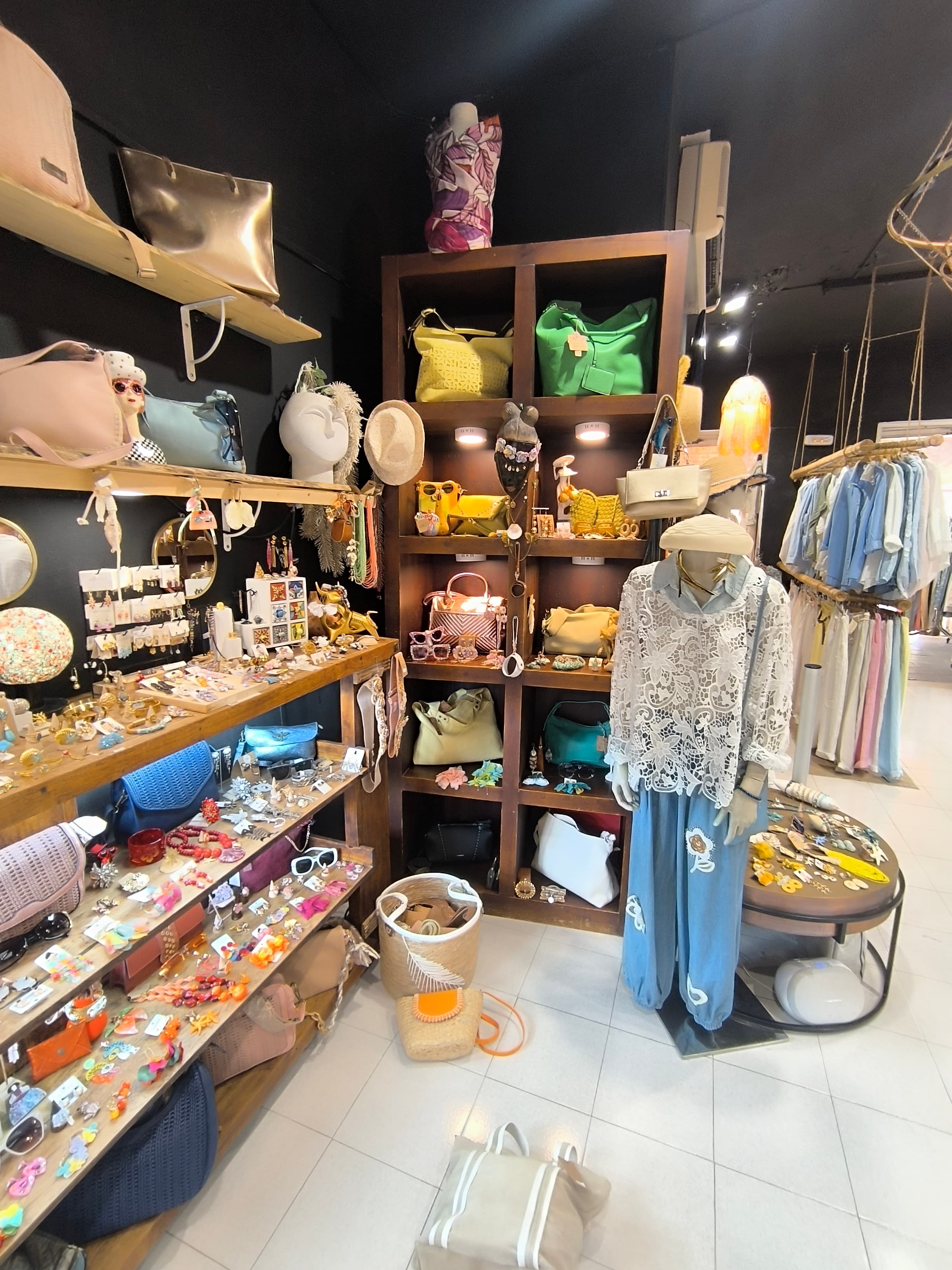 Bags and accessories on wooden shelves