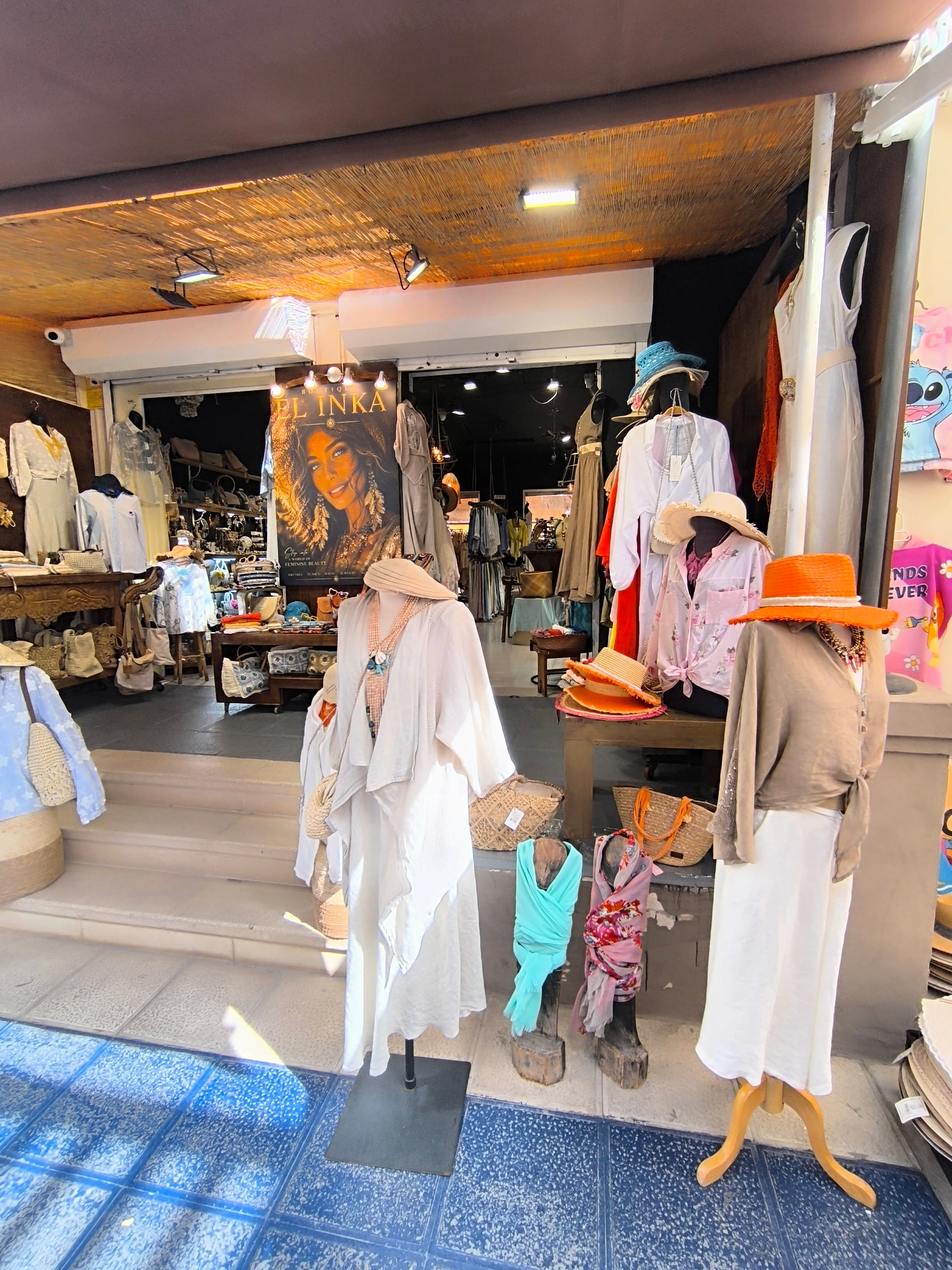 Boutique El Inka entrance in Playa Fañabé, with flowing white linen dresses on display