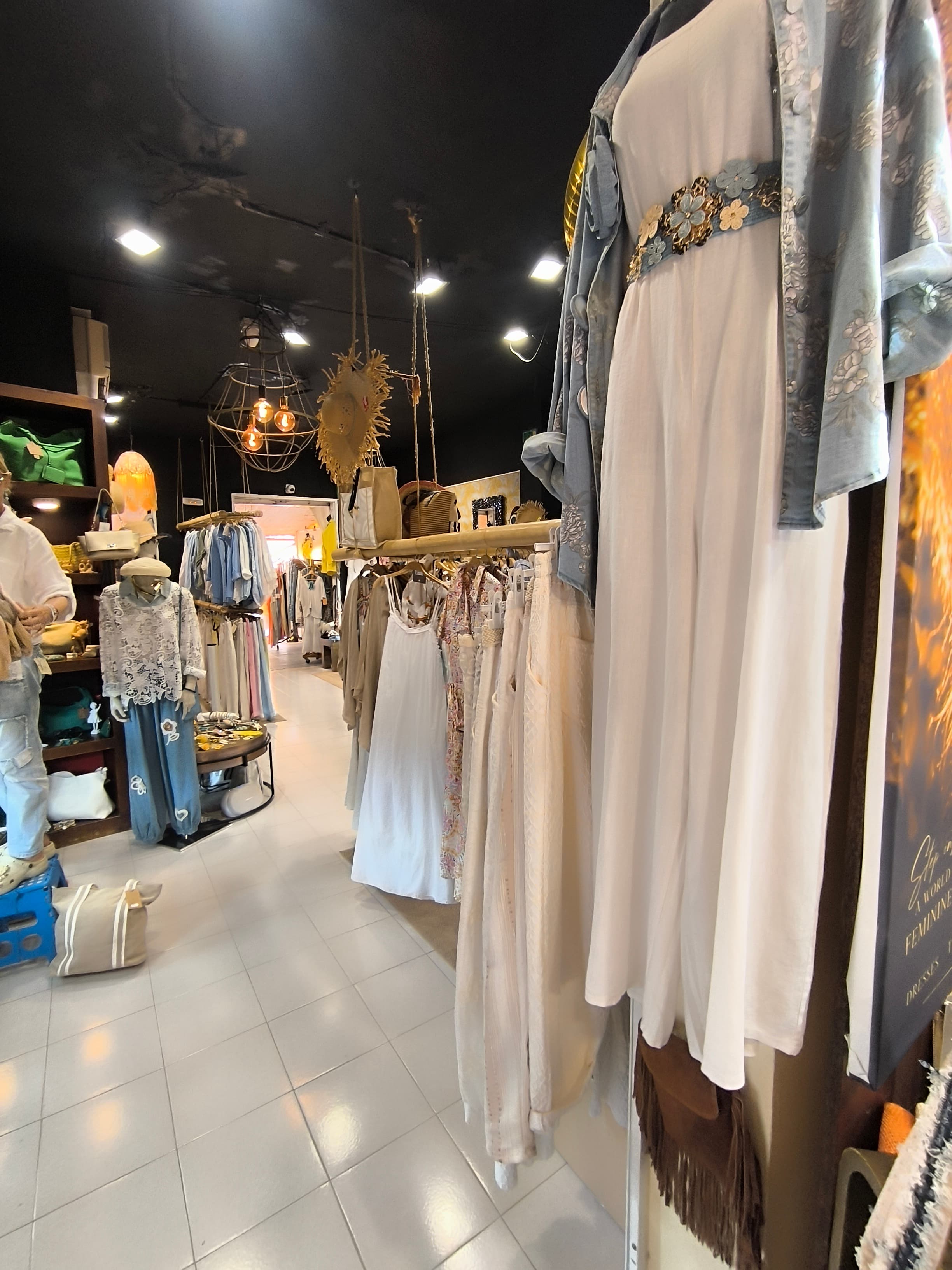 Linen dresses along the boutique hallway